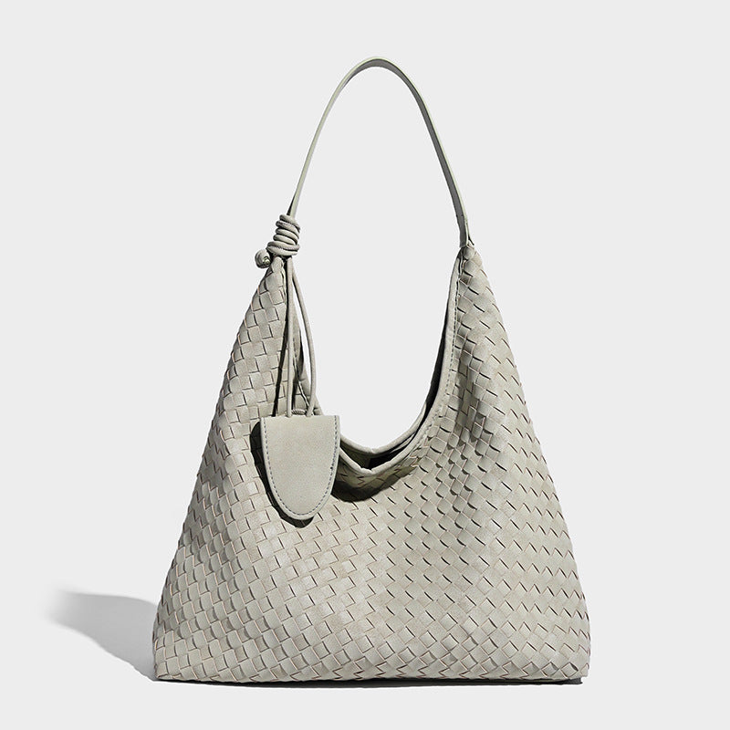 Slouchy woven hobo shoulder bag with knotted strap and matte leather-look textured finish, detail view 10