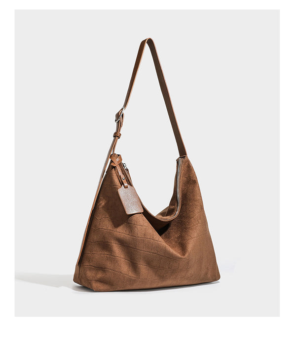 Slouchy croc-embossed matte hobo shoulder bag with adjustable strap and top zip closure, detail view 17