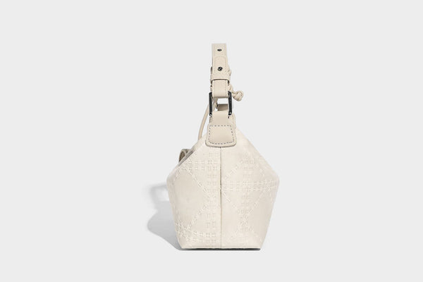 Small embossed half-moon shoulder bag with top zipper, detachable front pouch, and adjustable slim strap, detail view 15