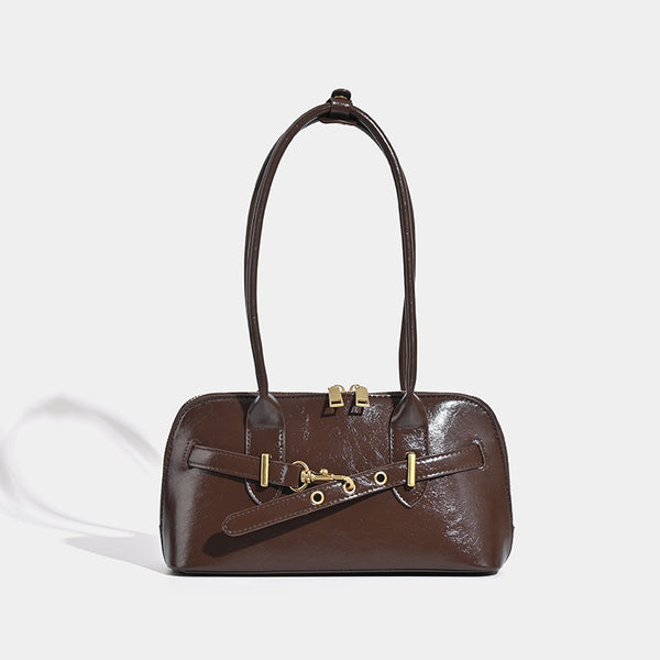 Small structured glossy leather-look shoulder bag with gold-tone buckle hardware and twin top handles, front view