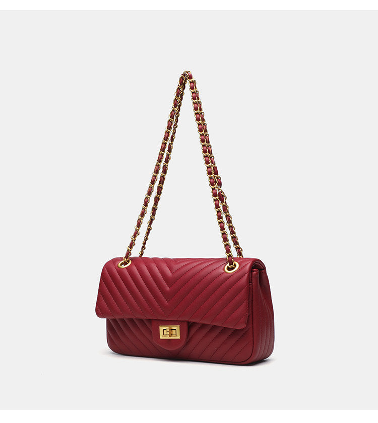 Structured quilted flap bag with gold-tone chain strap and turn-lock closure, detail view 7