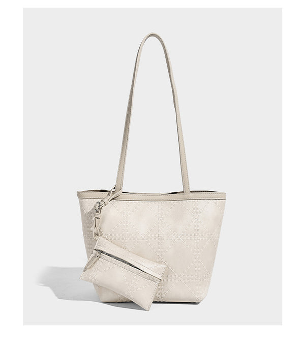 Quilted diamond-pattern tote bag with attached front zip pouch and long shoulder straps, detail view 7