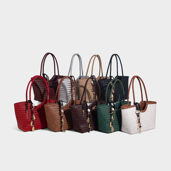 Large open-top woven tote bag with contrasting braided double handles and matching drawstring pouch, detail view 2
