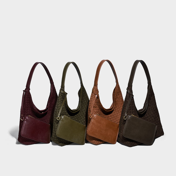 Large slouchy woven hobo tote bag with curved shoulder strap and triangular silhouette, detail view 2