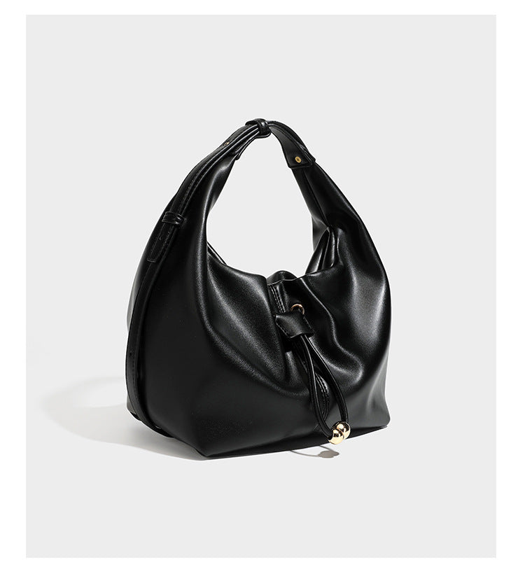 Slouchy hobo bag with smooth leather-look finish, drawstring cinch closure, and gold-tone bead hardware, detail view 8