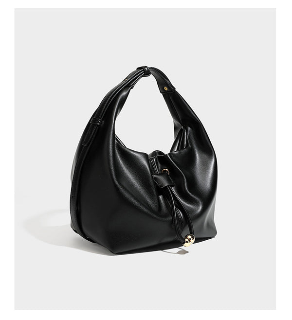 Slouchy hobo bag with smooth leather-look finish, drawstring cinch closure, and gold-tone bead hardware, detail view 8