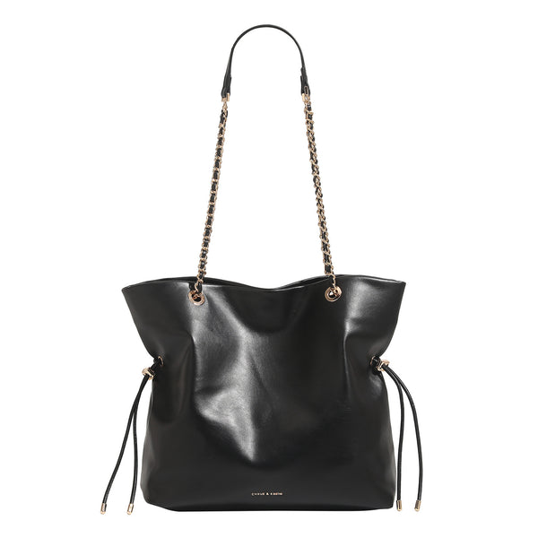 Soft-structured leather-look tote bag with gold-tone chain-and-strap shoulder handles and side drawstring cinches, detail