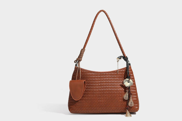 Woven-texture hobo shoulder bag in brown with braided top handle, adjustable crossbody strap, front flap pocket, and, detail