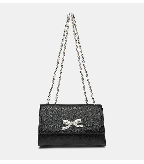 Structured rectangular flap crossbody bag with rhinestone bow and silver chain strap in pebbled finish, detail view 14