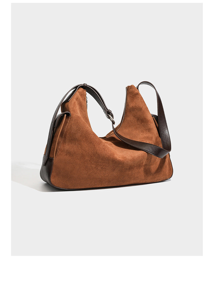 Slouchy cognac brown matte suede-look hobo shoulder bag with dark brown leather-look trim, top zip closure, front flap