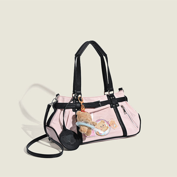 Pale pink nylon tote bag with black leather-look trim, double top handles, side zip pocket, and detachable crossbody strap