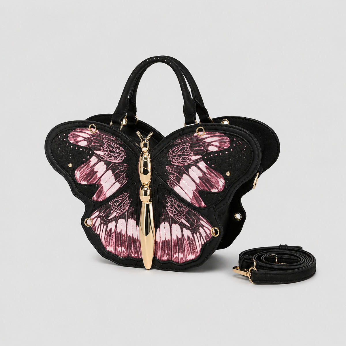 Schwarze Handtasche in Schmetterlingsform mit rosafarbenem Print auf den Flügelpartien und goldfarbenem, skulpturalem Reißverschlussanhänger in Form eines Schmetterlingskörpers, Detailansicht 7