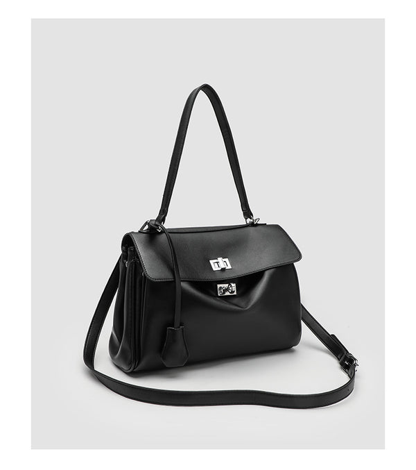 Structured black leather-look flap satchel bag with silver turn-lock hardware and top handle, detail view 15