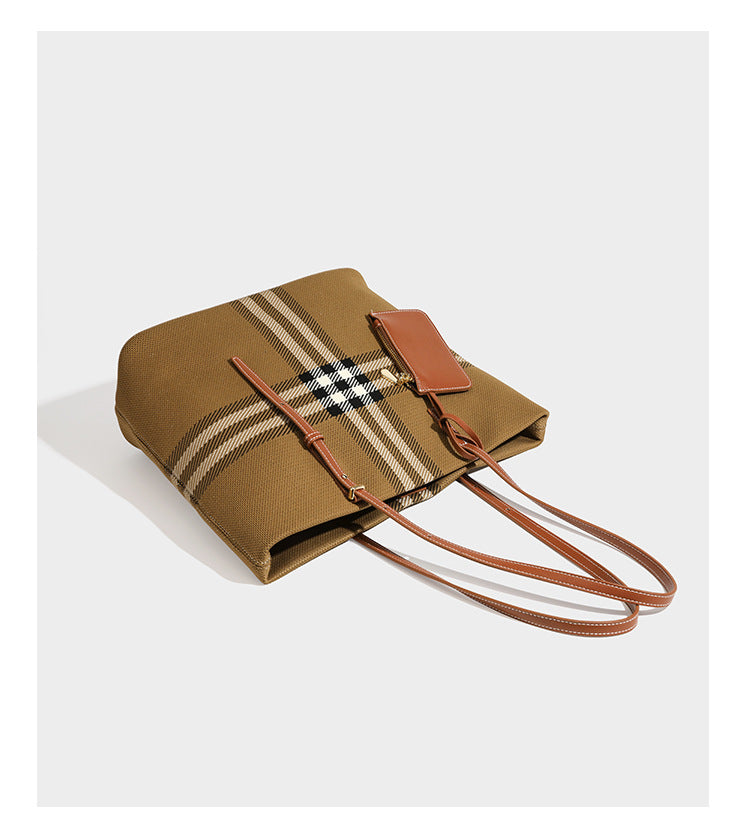 Large structured plaid check tote bag with smooth tan leather-look shoulder straps, attached front zip pouch, and gold-tone