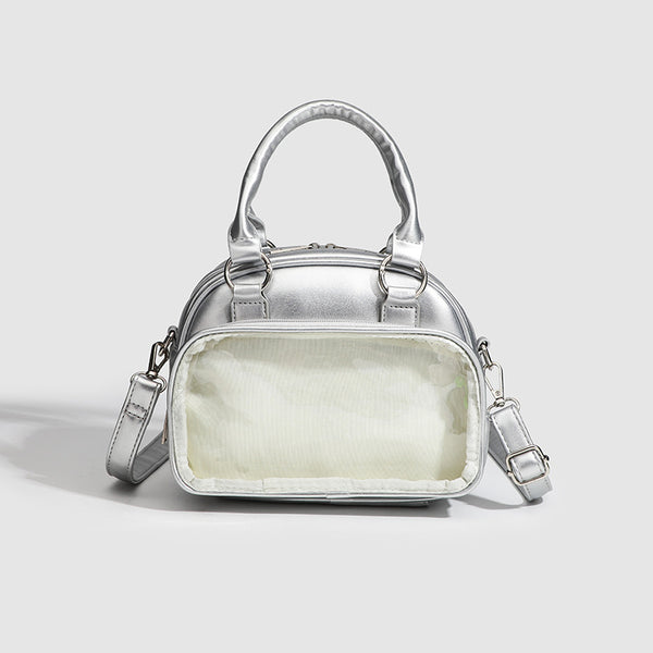 Structured mini bowling barrel bag with clear front pocket, dual top handles, and detachable crossbody strap in glossy