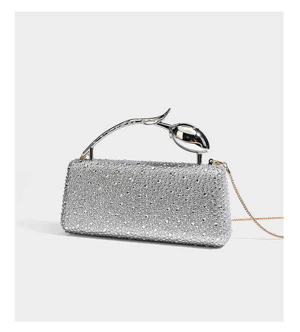rectangular hard-case rhinestone evening clutch with sculptural gold-tone branch-and-bud top handle and detachable chain