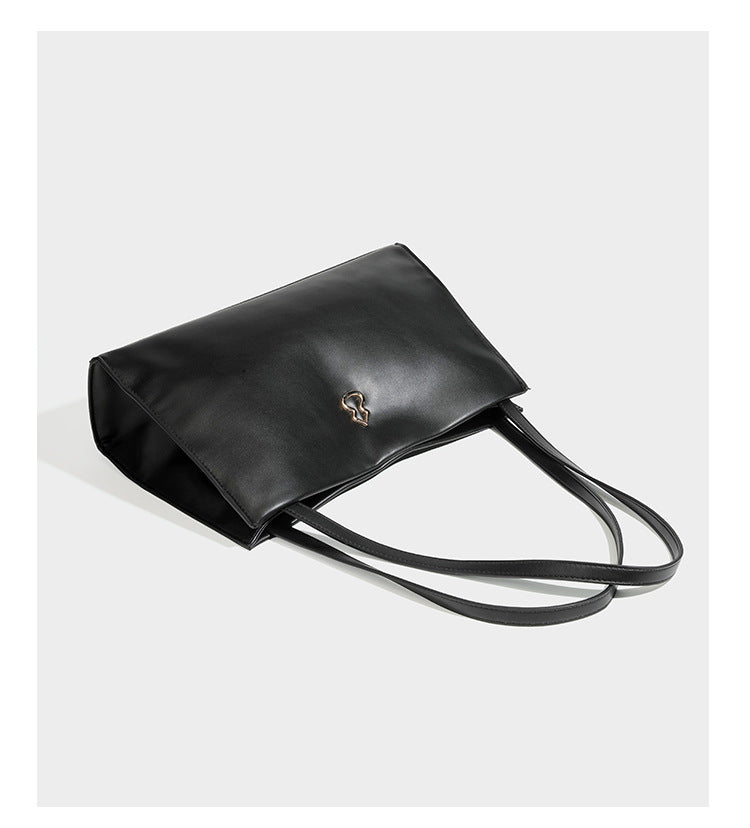 Structured rectangular shoulder tote bag with smooth leather-look finish, long double straps, and gold-tone gourd emblem on