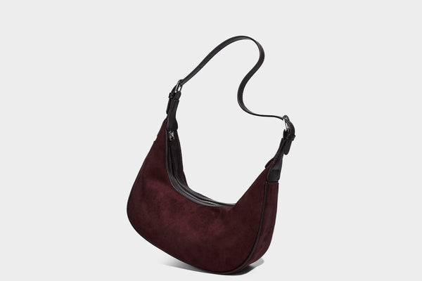Crescent hobo shoulder bag in matte suede-look finish with black trim and adjustable strap, detail view 26