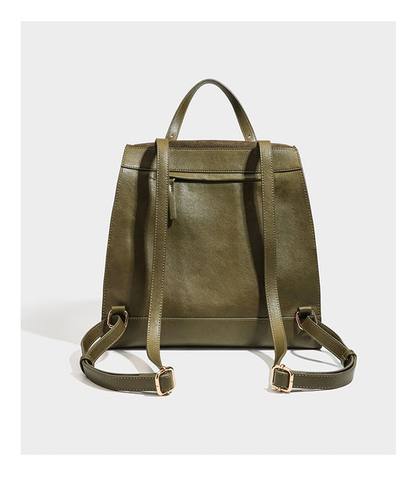 Structured suede-look convertible backpack handbag with flap closure and gold-tone emblem hardware in chocolate brown, detail