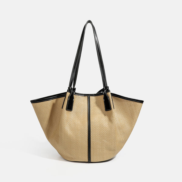 Tan woven tote bag with contrasting leather-look trim, long shoulder straps, and detachable rectangular zip pouch, detail