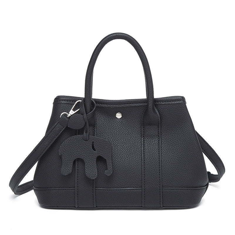 Structured pebbled leather-look top-handle tote bag with elephant charm and detachable shoulder strap, detail view 12