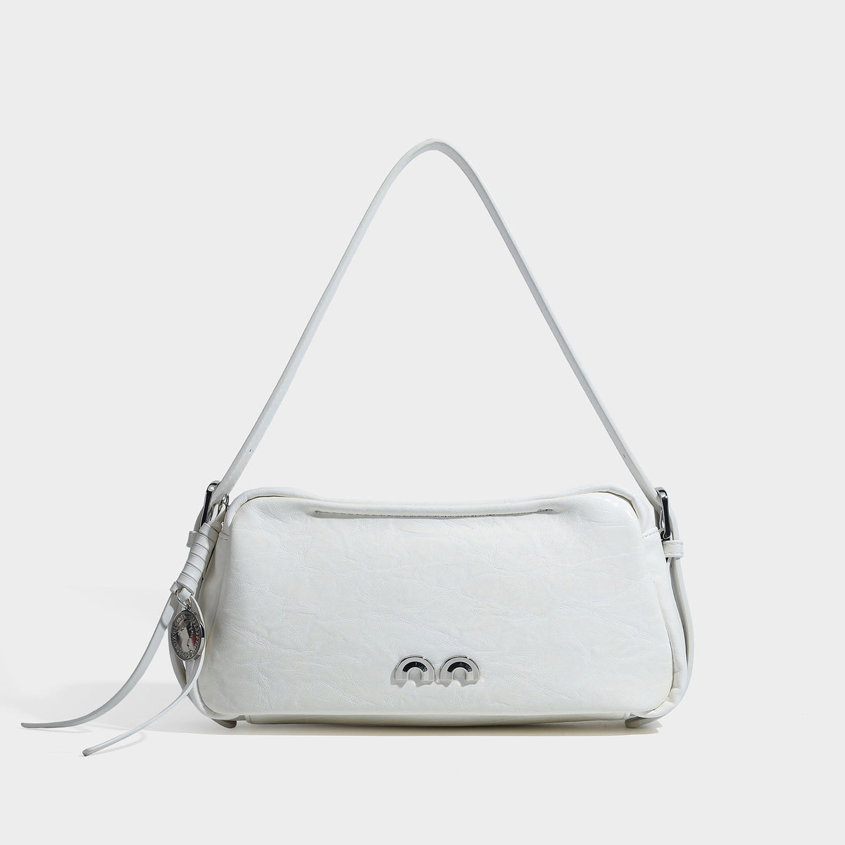 Compact black crinkled leather-look baguette shoulder bag with gold-tone arch hardware and adjustable strap, detail view 6