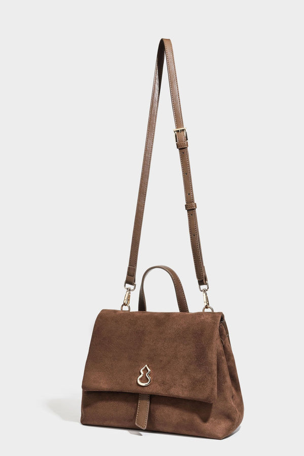 Formstabile Satchel-Tasche mit mattem Veloursleder-Finish, Überschlag, goldfarbenen Emblem-Beschlägen, kurzem Tragegriff und verstellbarem Crossbody-Riemen