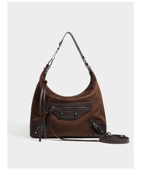 Slouchy suede-finish hobo shoulder bag with dark hardware, exterior zip pocket, tassel ties, and detachable crossbody strap