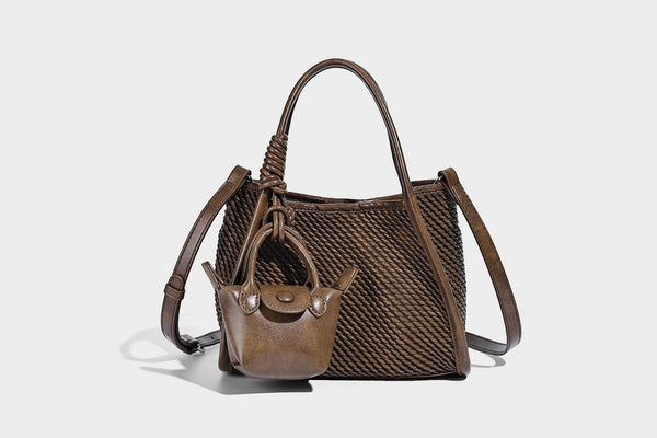 Large structured woven rope-texture tote bag with smooth leather-look trim, knotted dual top handles, detachable mini front