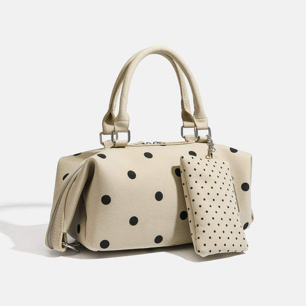 Strukturierte cremefarbene Henkeltasche mit Punktemuster, zwei Henkeln oben, silberfarbenen Beschlägen, abnehmbarem Schulterriemen und befestigtem