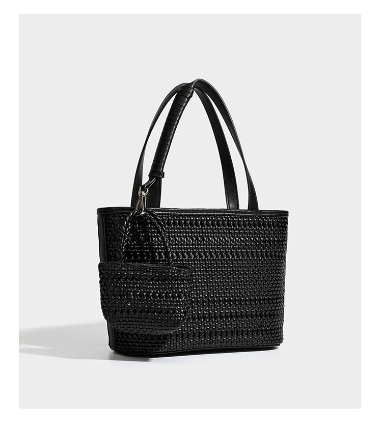 Structured open-weave tote bag with smooth leather-look trim, double top handles, detachable crossbody strap, and mini zip
