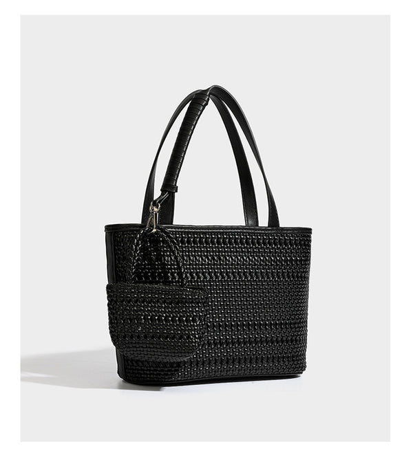Structured open-weave tote bag with smooth leather-look trim, double top handles, detachable crossbody strap, and mini zip