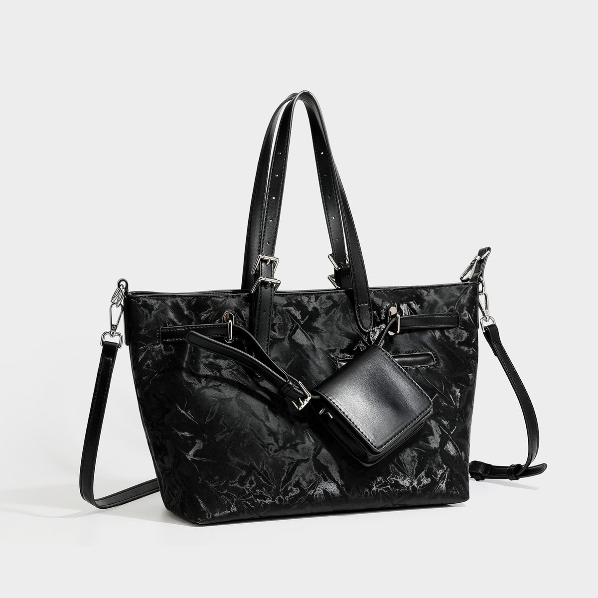 Glossy crinkled metallic-finish tote bag in brown with smooth leather-look top handles, silver-tone hardware, and attached