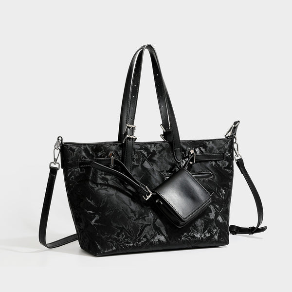 Glossy crinkled metallic-finish tote bag in brown with smooth leather-look top handles, silver-tone hardware, and attached