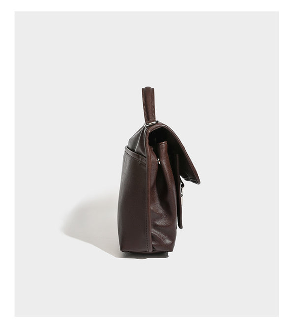 Structured rectangular satchel bag in dark espresso brown with smooth leather-look finish, flap front with silver turn-lock
