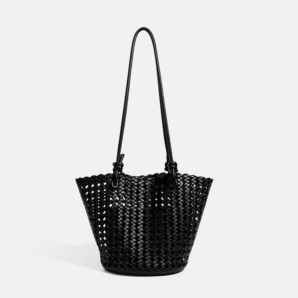 Open-weave lattice bucket tote bag with long knotted cord handles and tapered silhouette, detail view 9