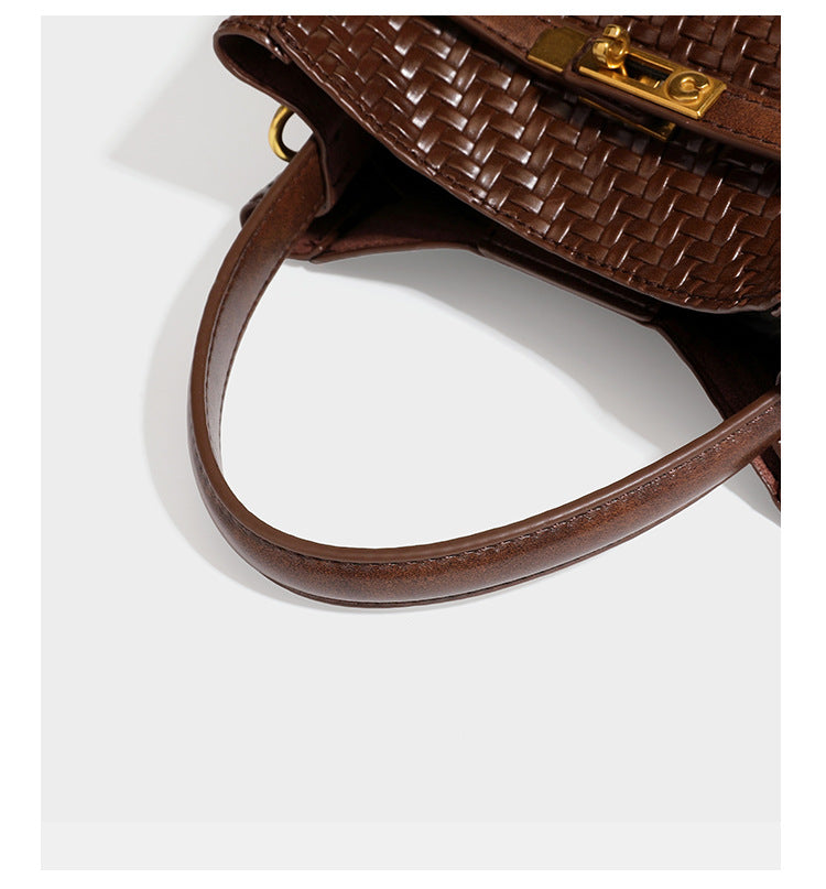 Structured woven leather-look bucket bag with gold-tone turn-lock hardware and detachable shoulder strap, detail view 25