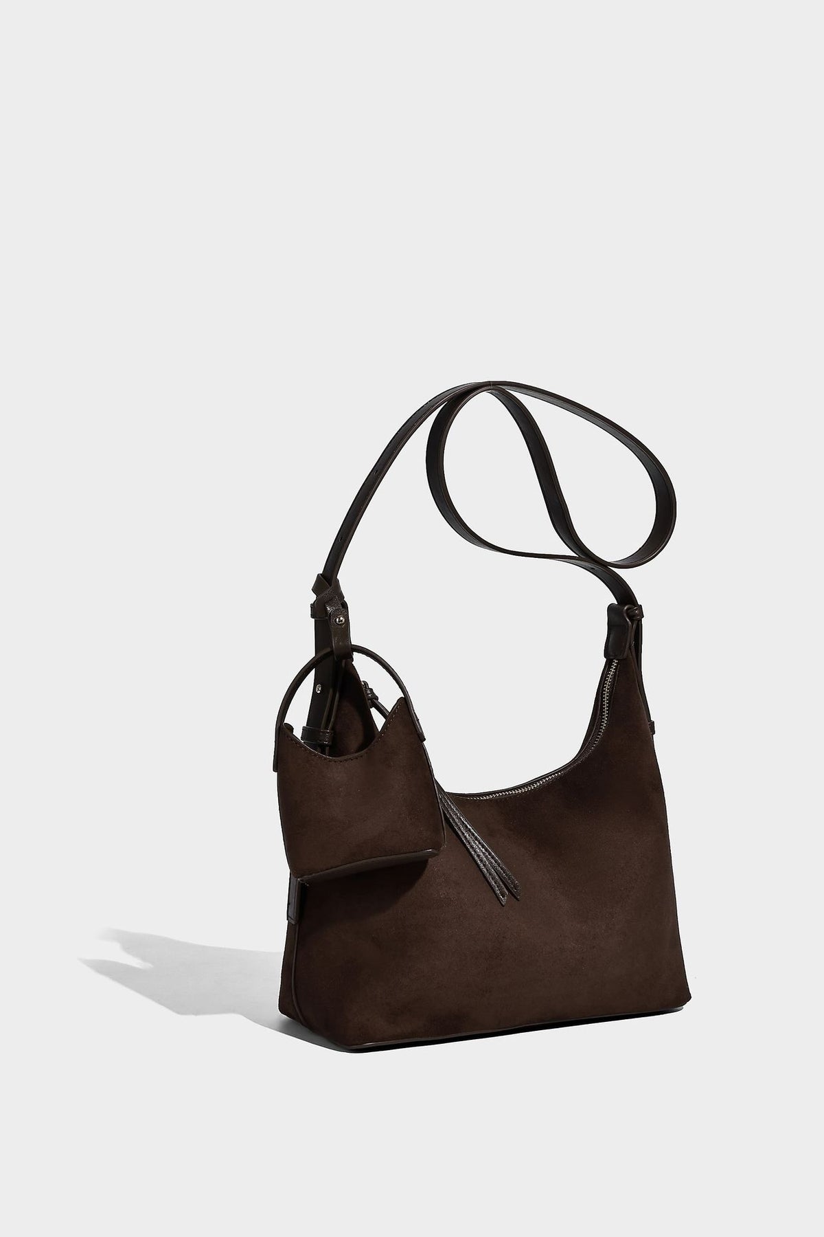 Dark brown suede-look hobo shoulder bag with top zip closure, adjustable strap, and small detachable mini pouch, detail view