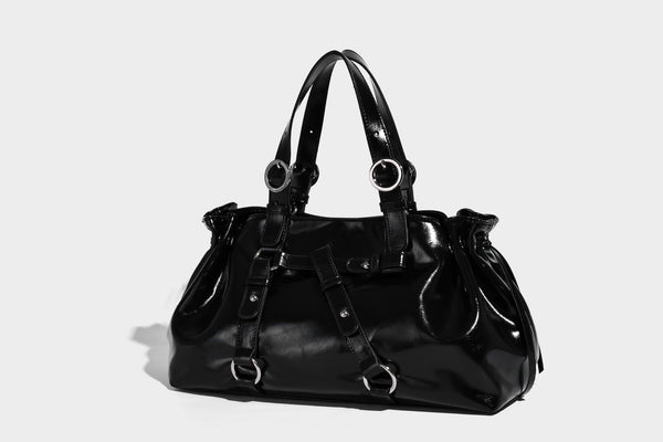 Glossy patent-look slouchy tote bag with ruched drawstring sides, dual top handles, silver ring hardware, and detachable