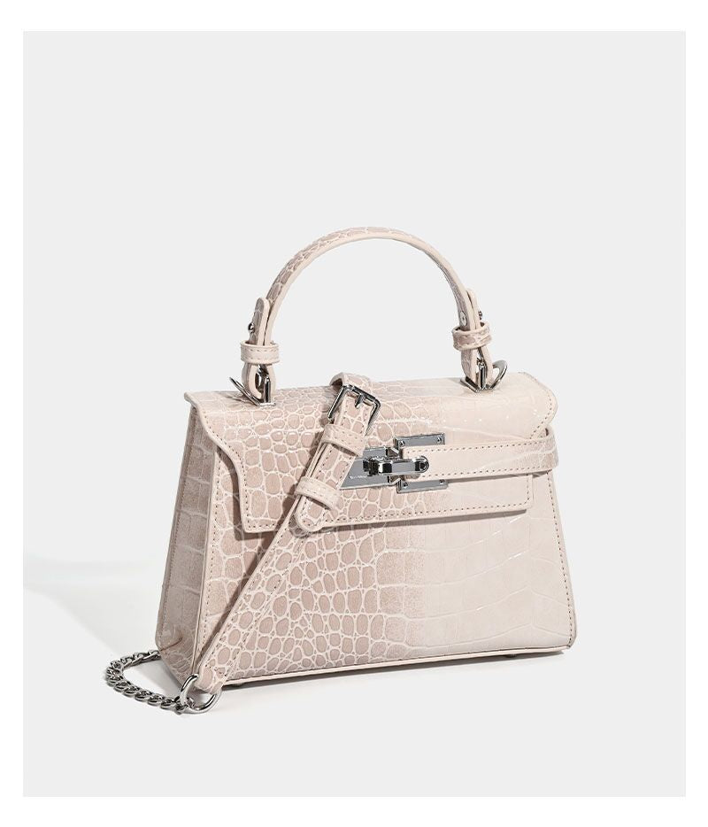 Croc-embossed mini top-handle satchel with silver turn-lock closure and adjustable crossbody strap, detail view 12