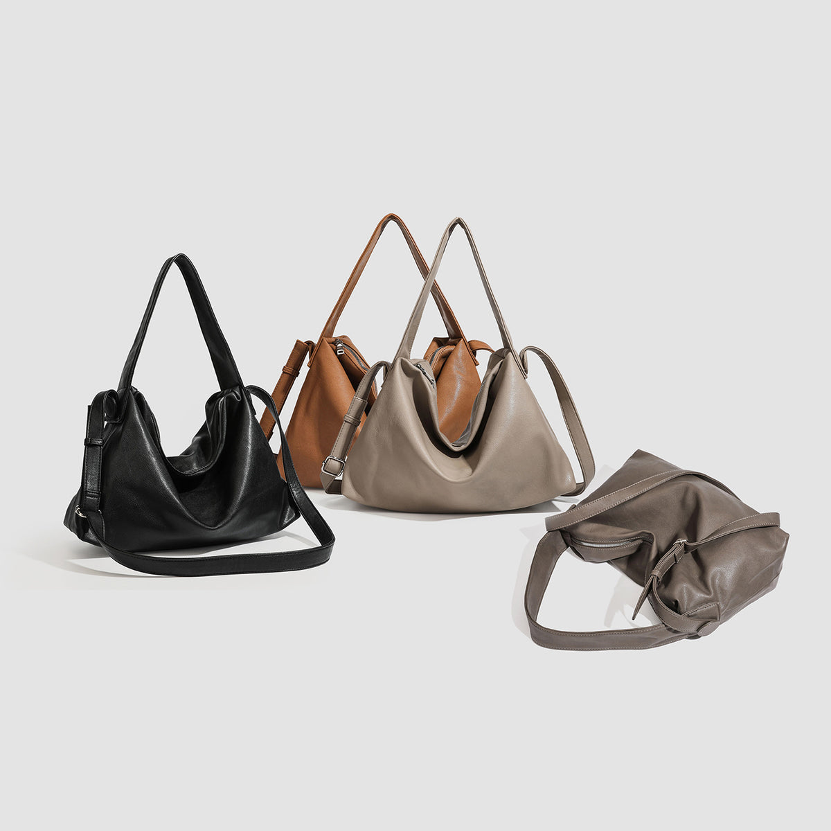 Slouchy leather-look hobo shoulder bag with top zipper and silver-tone hardware, detail view 2