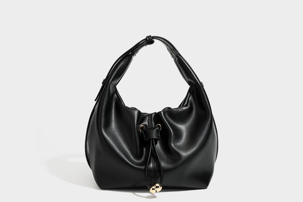 Slouchy hobo bag with smooth leather-look finish, drawstring cinch closure, and gold-tone bead hardware, detail view 24