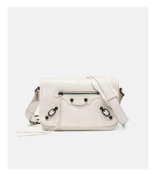 Small structured rectangular crossbody bag with crinkle leather-look finish, front zip pocket, gunmetal stud hardware, and