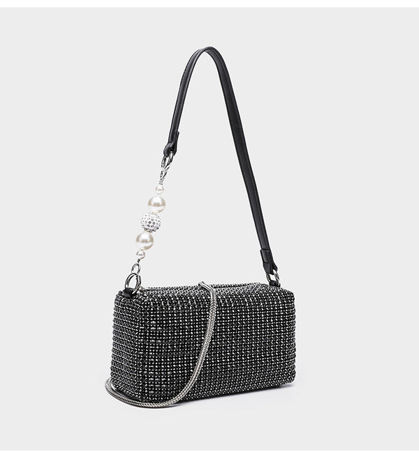 Small rectangular all-over rhinestone crossbody bag with pearl bead zipper pull and detachable silver chain strap, detail