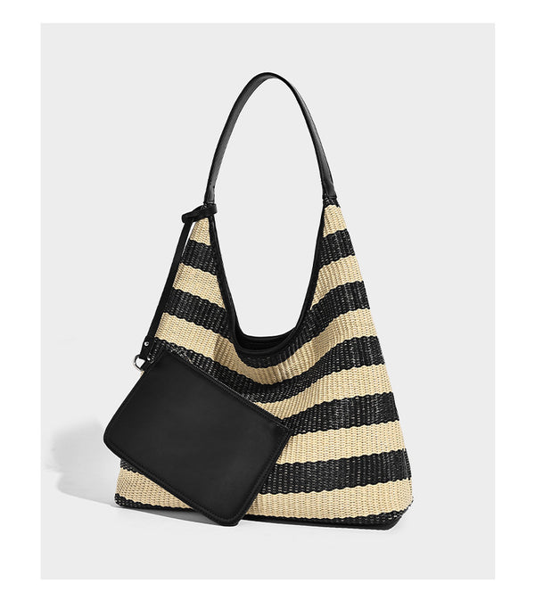 Black and beige striped woven shoulder tote bag with leather-look trim and detachable black zip pouch, detail view 7