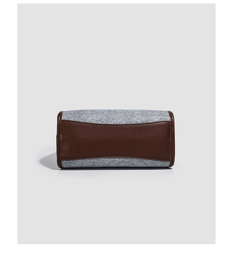 Small structured grey fabric shoulder bag with brown leather-look trim, gold-tone hardware, dual top handles, and detachable