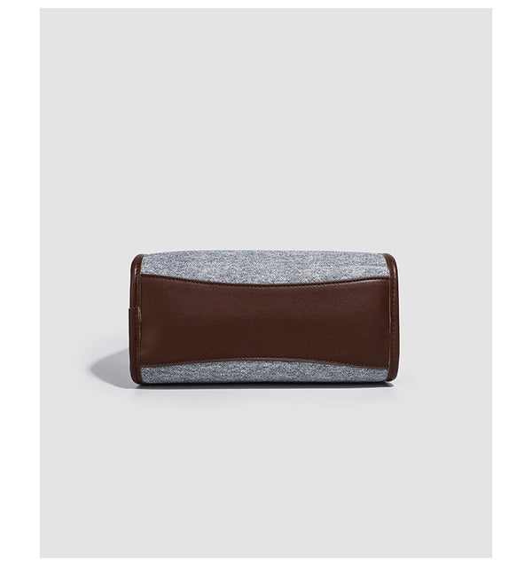 Small structured grey fabric shoulder bag with brown leather-look trim, gold-tone hardware, dual top handles, and detachable