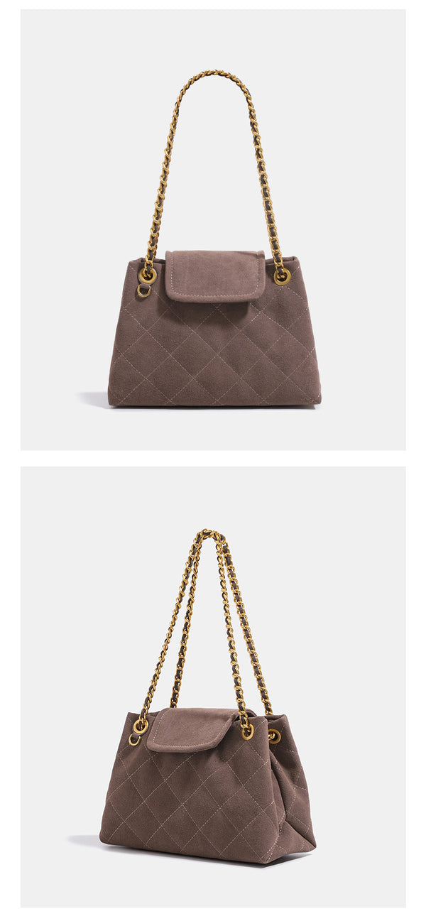 Quilted trapezoid shoulder bag with chain straps, flap closure, and ring hardware, detail view 10