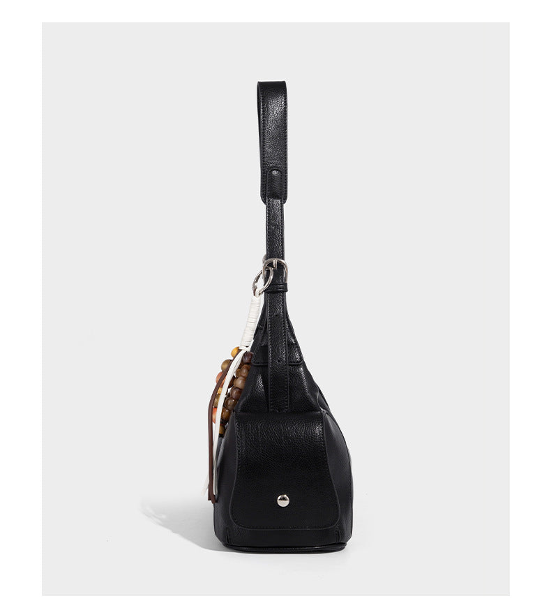 Soft pebbled leather-look hobo shoulder bag with zip top closure, side flap pockets, and silver-tone hardware, detail view 10