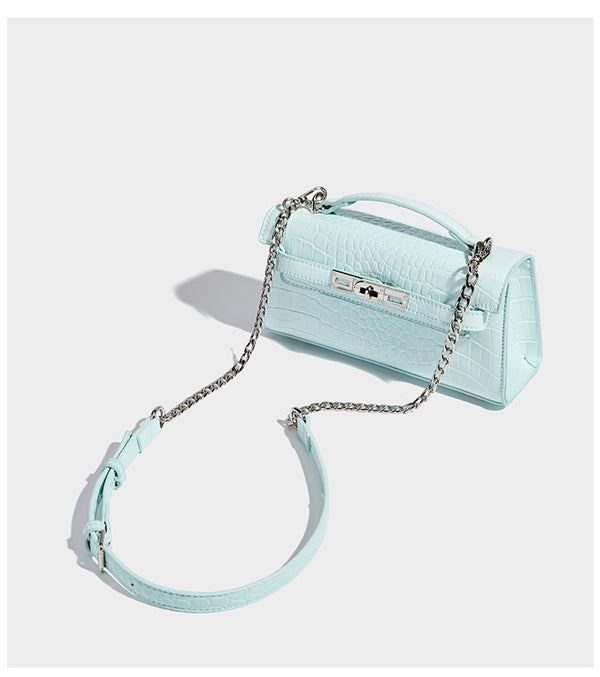 Compact structured flap satchel with glossy crocodile-embossed leather-look finish, silver-tone turn-lock hardware, and